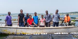 Alego Young turks members after feeding fish in their cages. Lake Zone. Tanzania