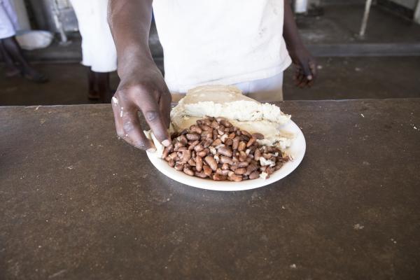 A prisoner’s meal of beans and sadza (pounded maize meal) at Mutimurefu Prison.