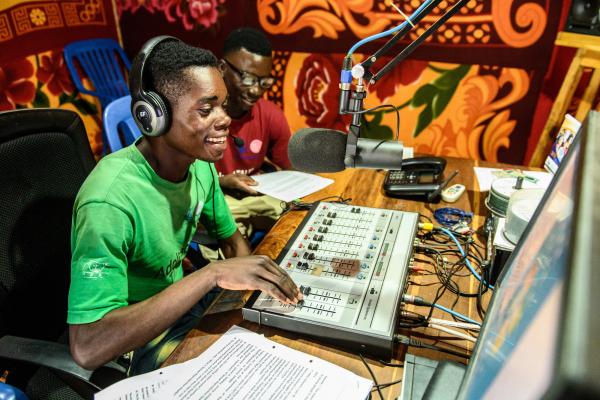Two young male peer educators in the studio as they present a health programme on Radio Bangweulu