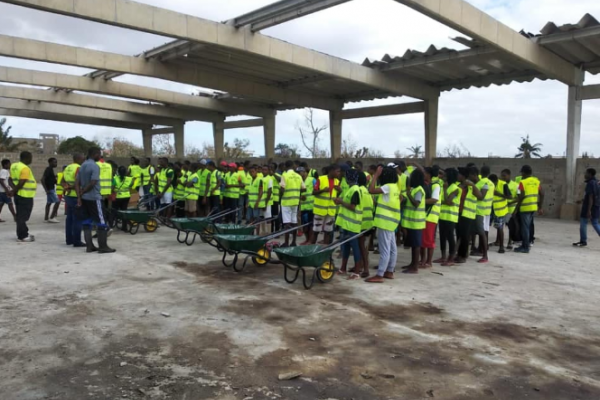 VSO volunteers clearing the way for reconstruction of a health center