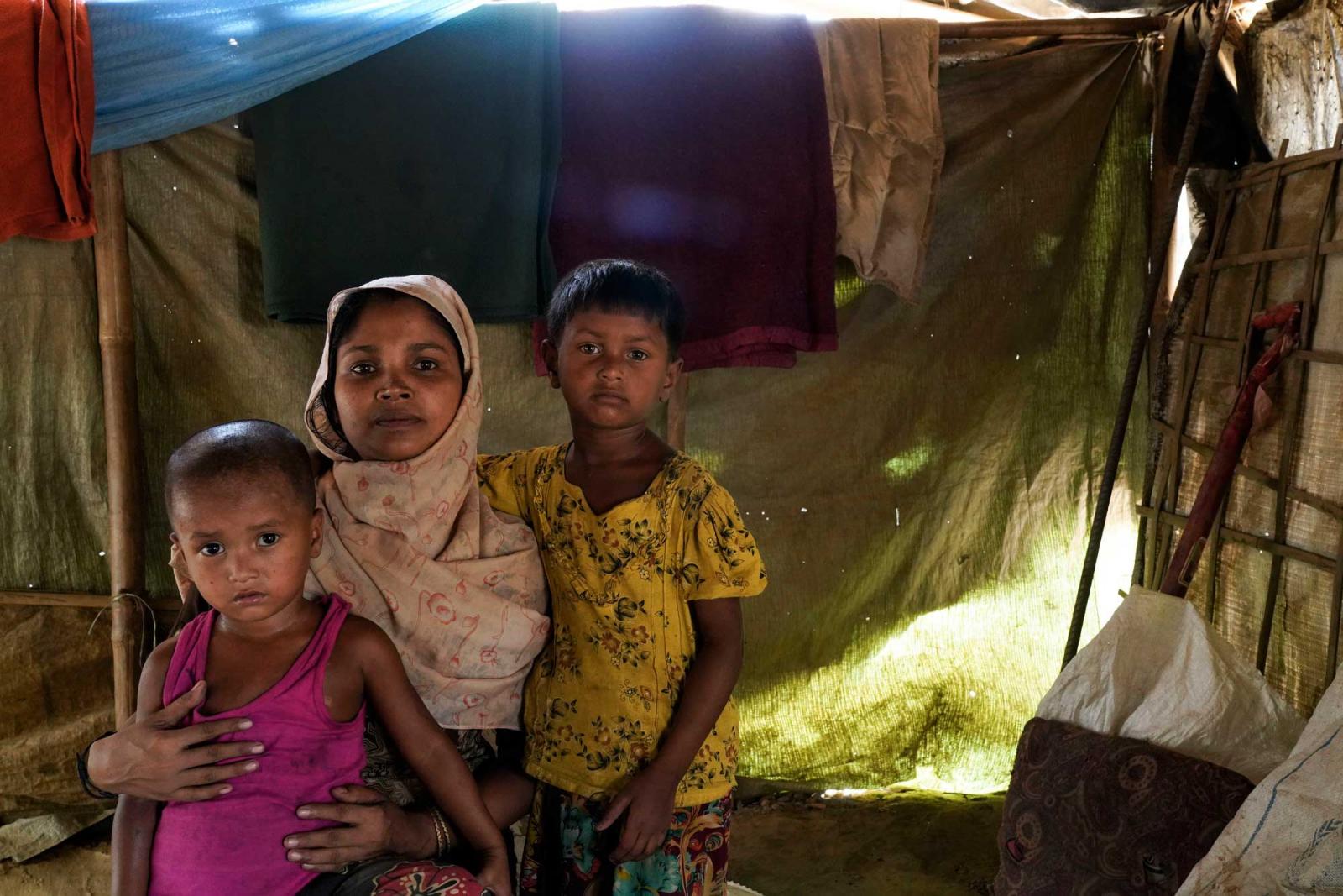 Sufia Begum (22) with her children inside their tent at Balukhali, Coxsbazar.