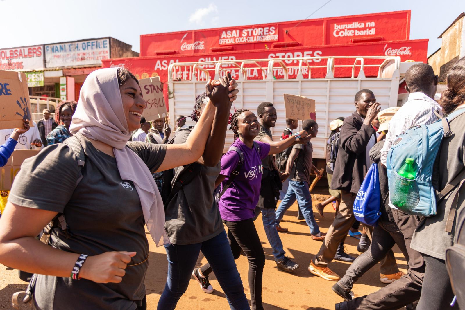 Nandi locals and VSO volunteers during the deafway project community awareness parade in Nandi town, Kenya