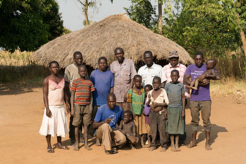 Man with his family in Uganda