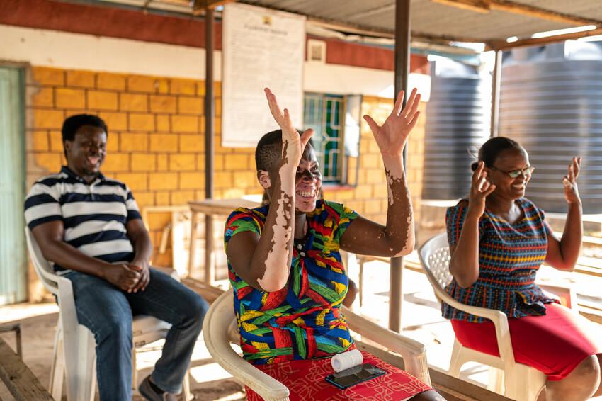 Health care workers learning Kenya Sign language