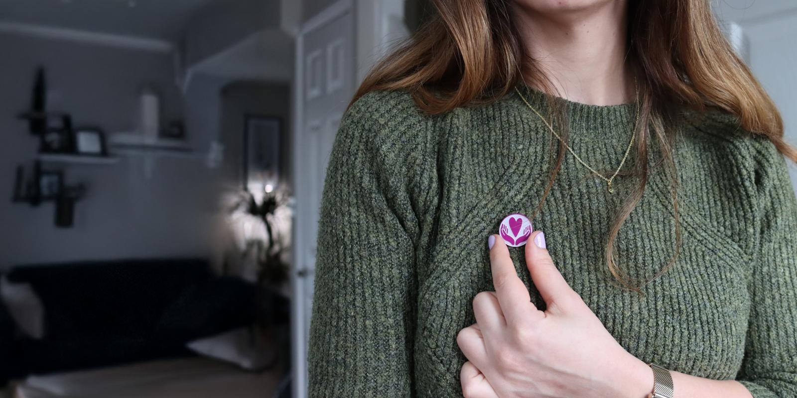 Woman wearing VSO pin badge