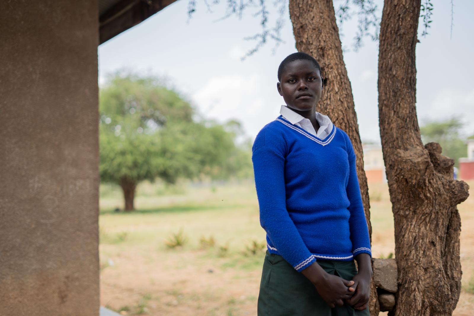 Emily stood in her school.