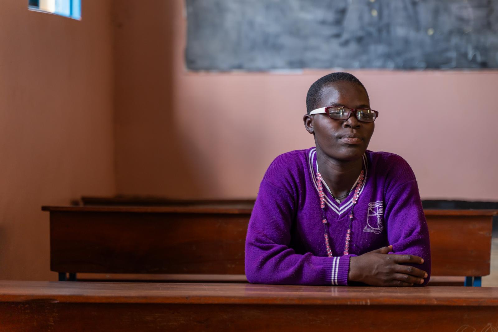 Alice sat alone in a classroom