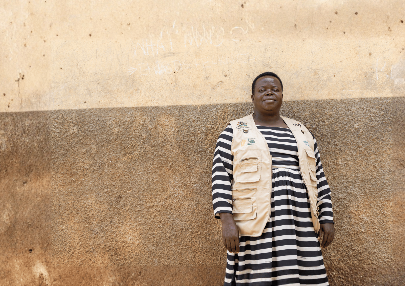 Semmy stands proudly in a school she works in