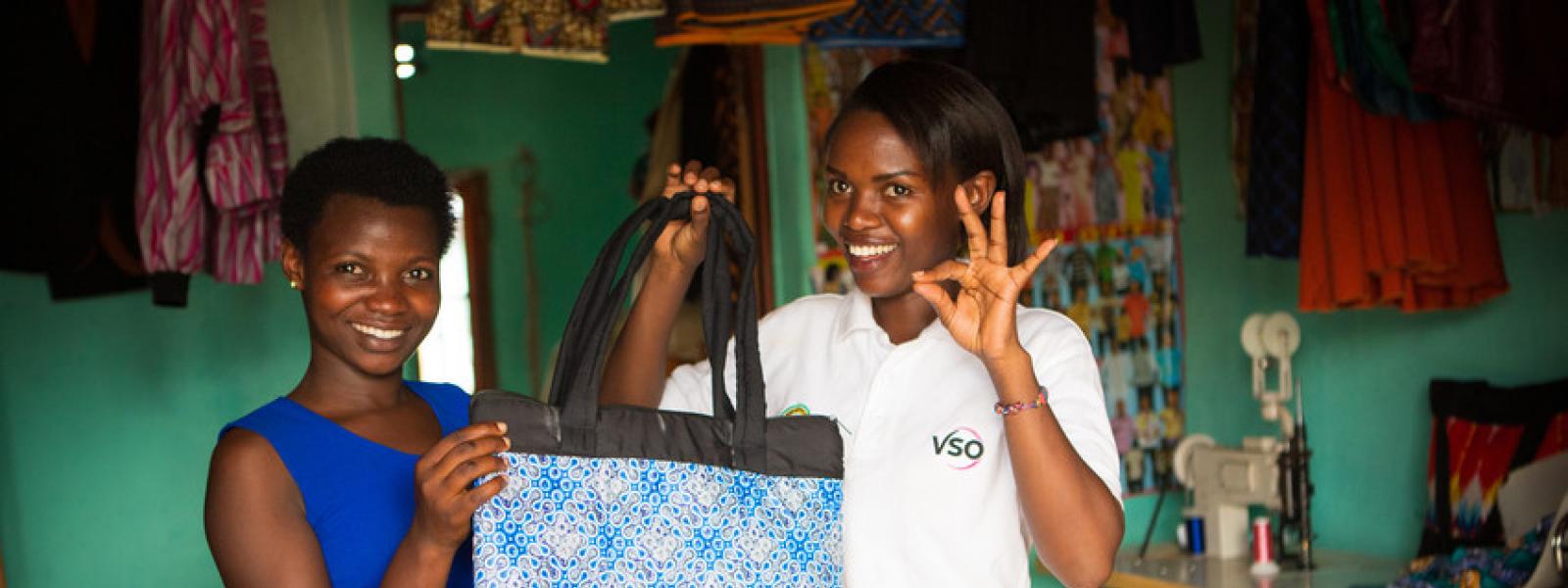 Deaf student making bags at a Deaf School vocational centre with VSO national volunteer. Rwanda
