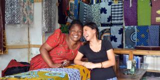 Volunteer Sandy Hung with Mayemba Mtema, a small shop owner in Tanzania