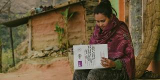 Laxmi Karki filling the record book as part of VSO research into gender based violence in Nepal