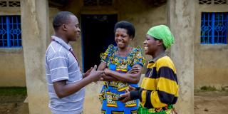 Safari Camille, VSO National Volunteer discussing with Nyirahakizimana Berthilde and Musabimana Chantal both members of Twisungane COCOMA