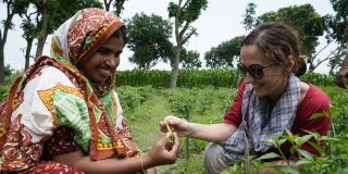 Volunteer in Bangladesh. Members of Chuhor Women in Agriculture Pilot group shows a chili to Mithapukur. Rangpur.