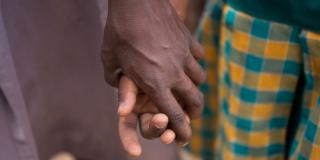 Students holding hands in the yard at Goriko School, Talensi District, Bolgatanga Ghana.