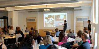 A VSO volunteer gives a talk about their experiences