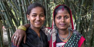 Adult Champion Sunti poses for a photo with one of her "little sisters" - Sunti
