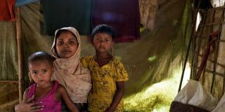 Sufia Begum (22) with her children inside their tent at Balukhali, Coxsbazar.