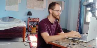 James Russell works at his laptop from his placement accommodation in Surkhet, Nepal.