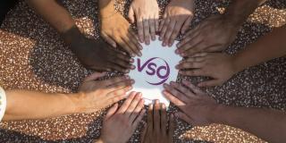 Close up of the hands of a VSO ICS team in Battambang, Cambodia