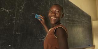 Mojo smiling at the chalkboard