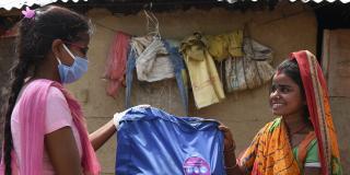 VSO volunteers distributing hygiene kits