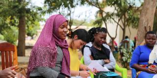 National volunteer Asha conducts an aspirations analysis with young female applicants to the Lake Zone Youth Empowerment project.