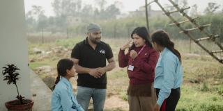 Young girls being taught sign language