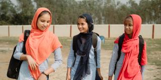 Baano and her colleagues walking to school