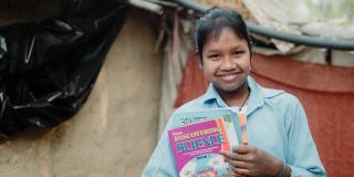 Deaf girl with science book