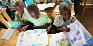 Rwandan primary school children with text books