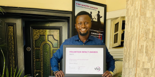 Abdulahi with his award certificate and gift