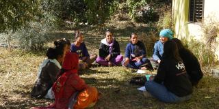 Community wives engaging in a group session