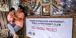 Joceyln with her granddaughter in the rice trading store