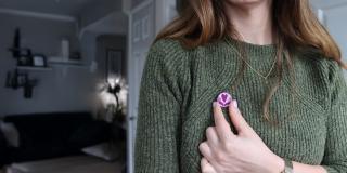 Woman wearing VSO pin badge