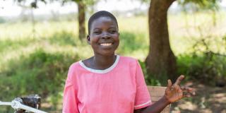 Nangiro in her wheelchair, smiling.