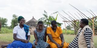 Four women together laughing.
