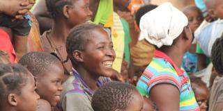 Smiling woman in crowd in Mozambique Smiling woman in crowd in Mozambique