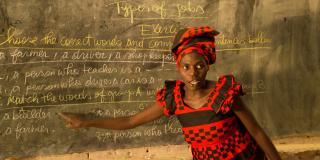 Teacher in classroom in Rwanda