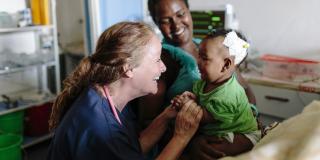 VSO volunteer Patricia Doyle with seven-month-old baby Eldana Akieiu and her mother Abaynesh Girma in the new paediatric High Dependency Unit (HDU) at Nigist Eleni Mohammed Memorial Hospital in Hosanna, Ethiopia
