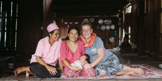 VSO volunteer Ans Ohms, midwife in Cambodia, with local colleague and mother 