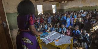 Teacher with a large class size in Malawi