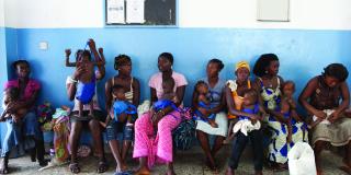 Mothers with their babies waiting at a clinic in Sierra Leone | VSO Mothers with their babies waiting at a clinic in Sierra Leone | VSO