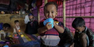 Rohingya children play with the toys donated by VSO