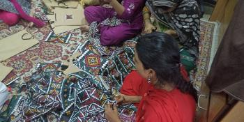 Women participating in a sewing workshop at Panah shelter