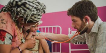 Volunteer Dr Lynch with 2 year old Laxmi, Nepal
