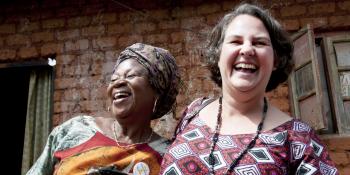 Two women laugh together