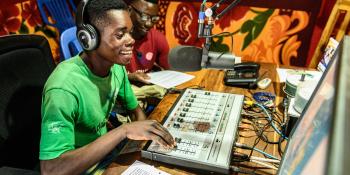 Two young male peer educators in the studio as they present a health programme on Radio Bangweulu