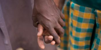 Students holding hands in the yard at Goriko School, Talensi District, Bolgatanga Ghana.