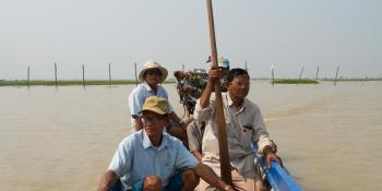 Four men in a fishing boat on Lake Tonle Sap