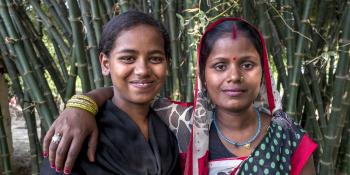 Adult Champion Sunti poses for a photo with one of her "little sisters" - Sunti